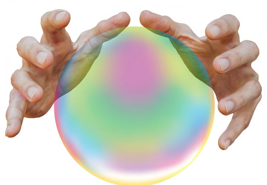 Person's hands near White Magical Iridescent Ball