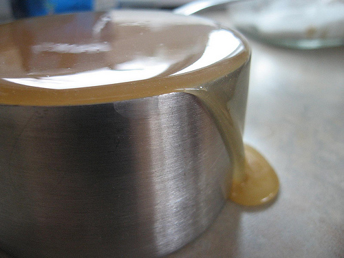 Rice syrup has a light texture and flavor.   http://www.flickr.com/photos/knitsteel/3089564653/   