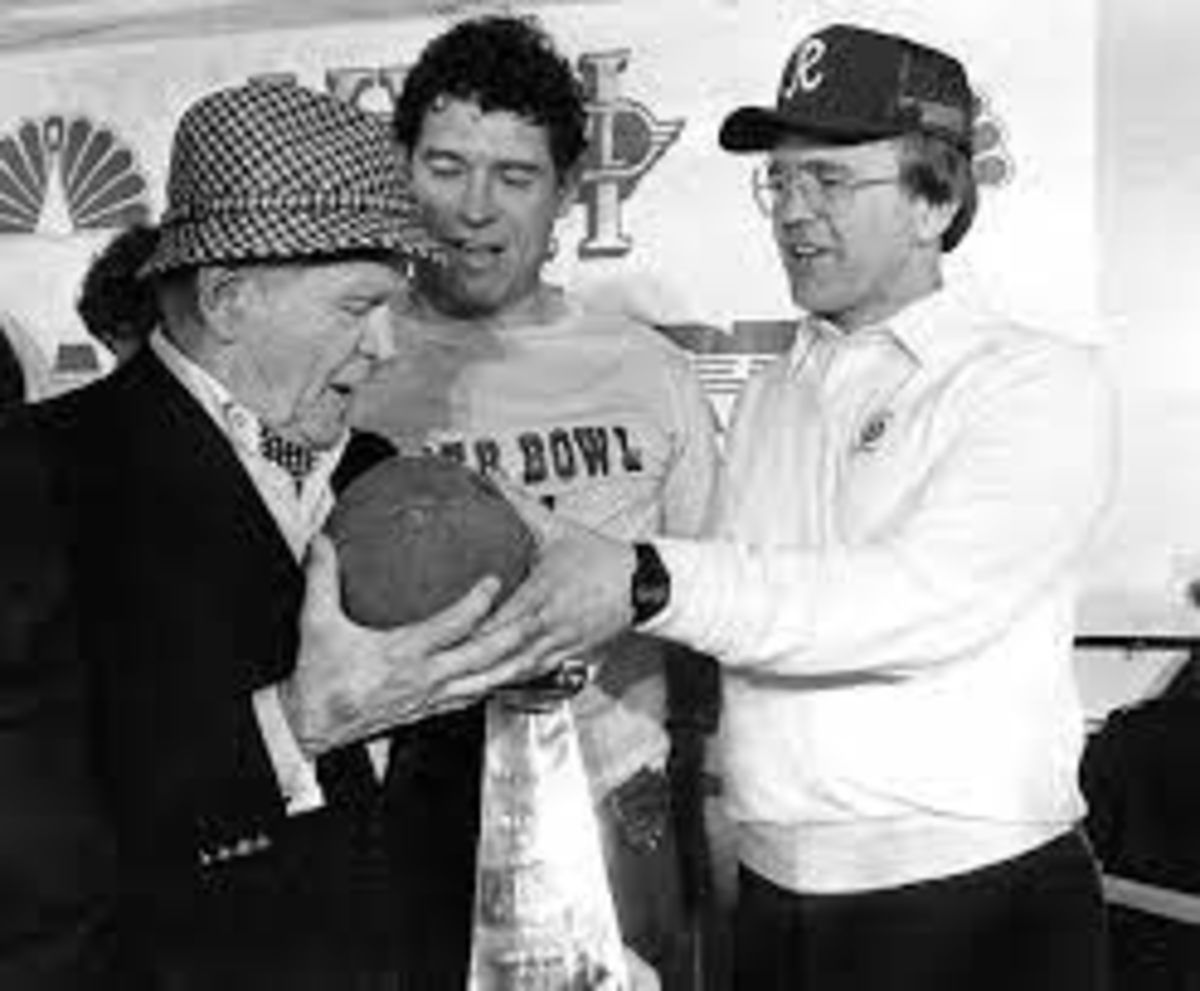 Owner Jack Kent Cooke, Fullback John Riggins, and Coach Joe Gibbs celebrate their back-to-back Super Bowl victory