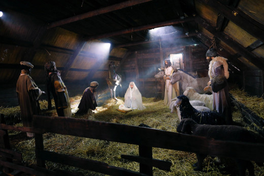 A living nativity scene in a barn.