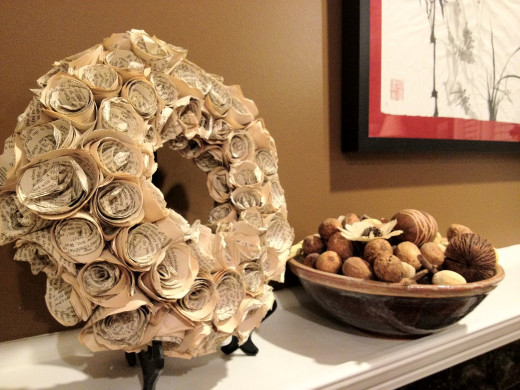 You can create a cut and glue type of flower or opt for a rolled paper flower as in this wreath
