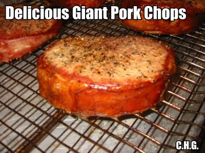 A close up of the giant pork chop cooking. 