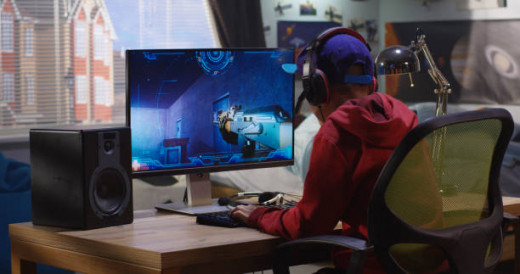 A man playing a game on a computer