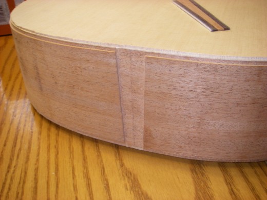 The tail of the guitar chiseled out and ready for the tailpiece.  