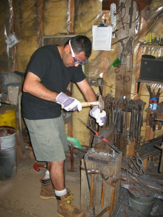 Blacksmith Class Student Punching and Drifting