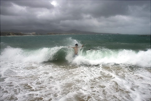 It's an ill wind that blows nobody any good.  Surfing to Jimena's wind-driven waves is not for the faint-hearted.  amis ap photo