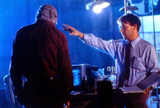 It's a brave decision by Raimi (right) to obscure his leading man's face for most of the film but Neeson (left) somehow pulls it off.