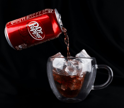 Dr. Pepper drink pouring into a mug, photo by Yana Smetana on Unsplash