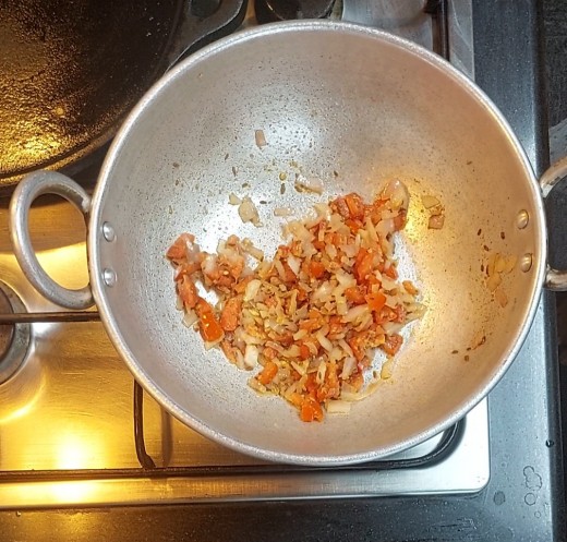 Once well fried, add 1/4 cup chopped tomato, fry till tomato turns soft.