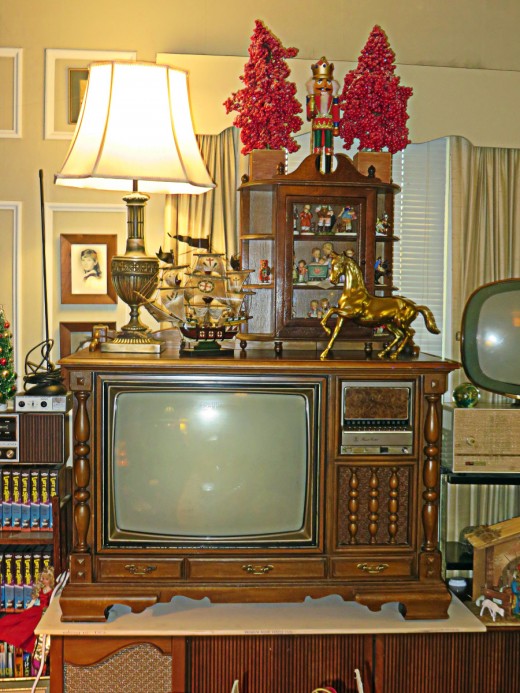  Sears and Roebuck Color Console Television 564-44670700, Madison Model also called the Monticello, Colonial-style cabinet with dark maple-veneered top, Sides and front of simulated wood and wood, with matching finish. $774.95.