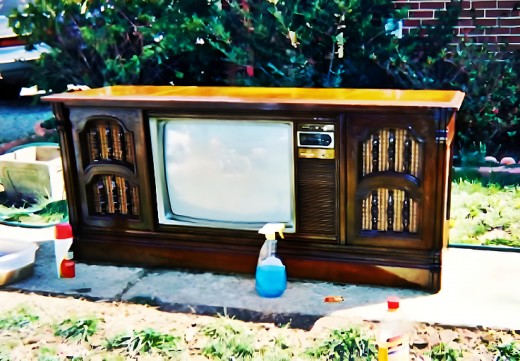  Beautiful Magnavox Three in One Console Color Television. It has a color television, AM/FM Radio, 8 Track tape player, and record player. I believe it dates from the 1970s. Made in Tennessee … and she is very lovely. 