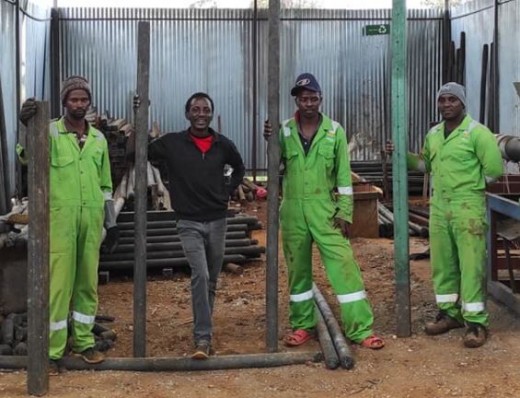 Mugo with some of his employees at his workshop
