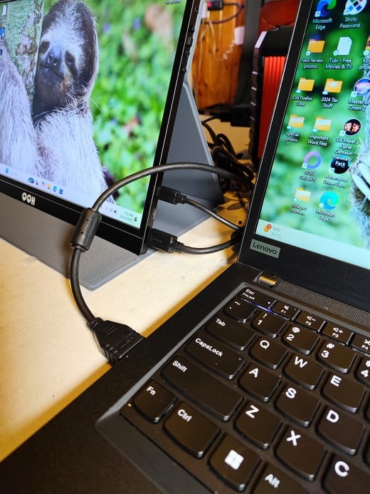 Connecting the monitor to a power source and the HDMI port of a laptop
