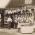 Old style butchers.  Shows rabbit and other game hanging for sale.  No 'elf 'n' safety back then, and we were better for it.    photo from allposters.com  