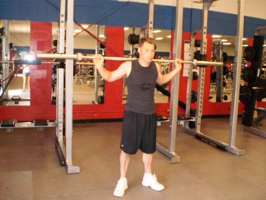 The Barbell Good Morning start position.