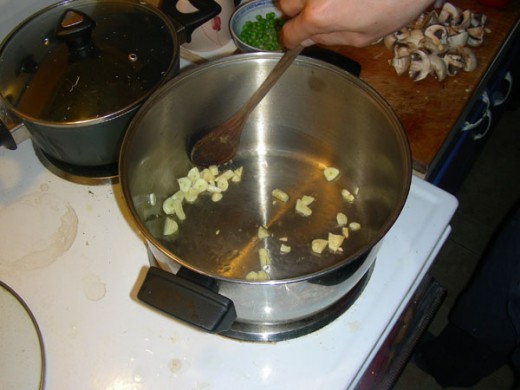 Add 2 tablespoons of olive oil in a pot and fry the garlic a bit