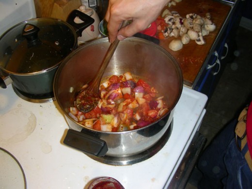 Add the tomato cubes, onions, and carrots