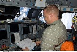 Eric Boe on the flight deck docking with the ISS.