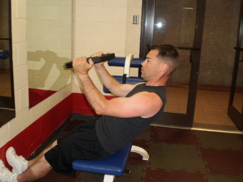 The Roman Chair Weighted Sit-up up position