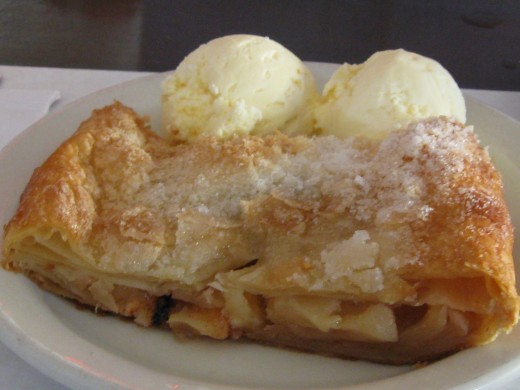 Plain apple strudel served with vanilla ice cream