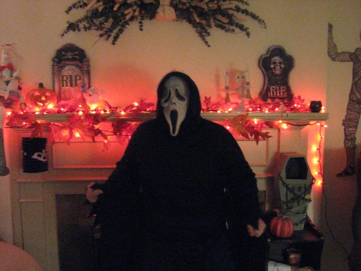 The kids stand in front of the Haunted fireplace during our party and we judge on their costumes..everyone gets a ribbon for something!