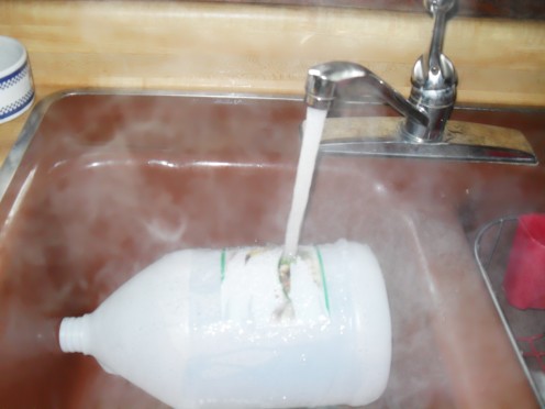 Use hot water to soak away paper labels and clean the recycled bottles out.