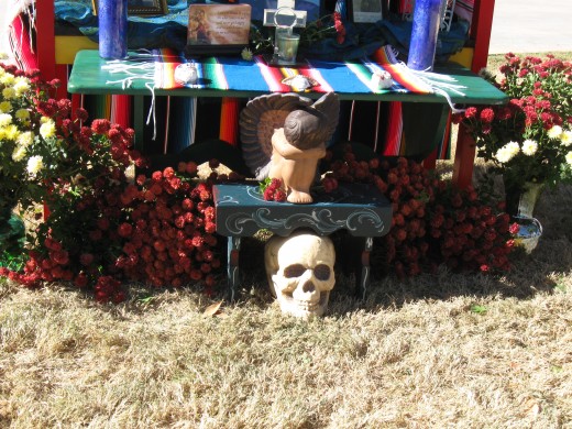 Skull is centerpiece in this family's El Día de los Muertos booth in Mesilla, NM