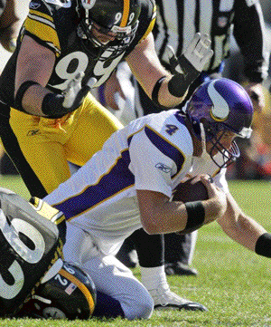 Pittsburgh Steelers linebacker James Harrison (92) sacks Minnesota Vikings quarterback Brett Favre (4) with the help of defensive end Brett Keisel (99) in the first quarter of an NFL football game in Pittsburgh, Sunday, Oct. 25, 2009. (AP Photo/Gene 