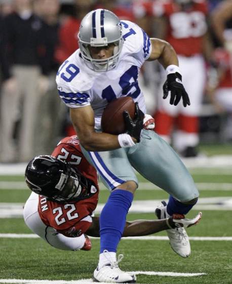 Dallas Cowboys wide receiver Miles Austin (19) breaks a tackle by Atlanta Falcons cornerback Chevis Jackson (22) during the first half of an NFL football game, Sunday, Oct. 25, 2009, in Arlington, Texas. (AP Photo/LM Otero)