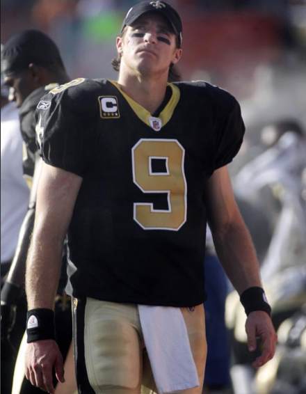 New Orleans Saints quarterback Drew Brees (9) looks up at the scoreboard in the second quarter against the Miami Dolphins during an NFL football game in Miami Sunday, Oct. 25, 2009. (AP Photo/Jeffrey M. Boan)