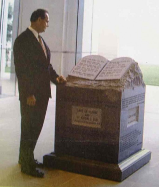 Alabama's Chief Justice, Roy Moore, shown here with the monument he refused to remove from the Alabama Supreme Court Building.