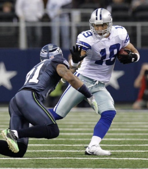 Dallas Cowboys WR Miles Austin (19) attempts to get around  Seahawks cornerback Ken Lucas, left, after making a reception in the first half 11/01/09 in Arlington, Texas. (AP Photo/LM Otero)