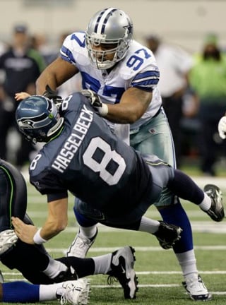 Seahawks quarterback Matt Hasselbeck is knocked to the ground by Dallas defensive end Jason Hatcher in the second half of Sunday's 38-17 loss. (AP Photo/LM Otero)