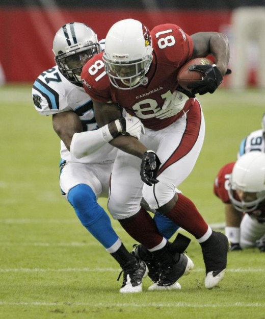 Arizona Cardinals wide receiver Anquan Boldin (81) is tackled by Carolina Panthers cornerback C.J. Wilson during the first half of an NFL football game Sunday, Nov. 1, 2009, in Glendale, Ariz. (AP Photo/Matt York)