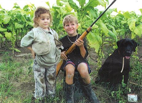 Oh my gosh!  Does that little boy even realize that he is handling his rifle safely?  He couldn't have been taught that.