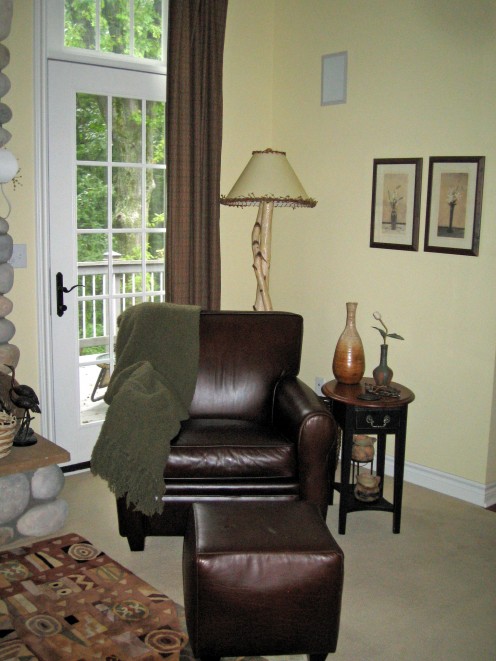 A brown leather chair adds warmth.