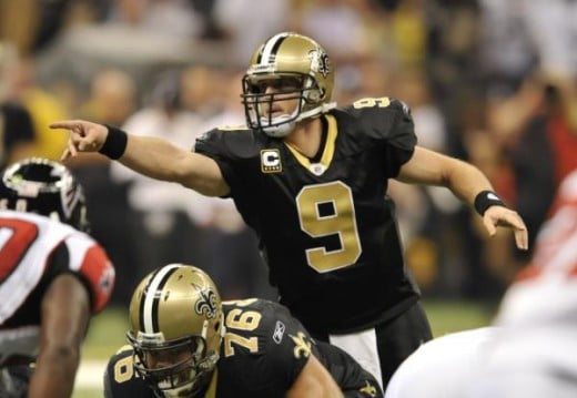 New Orleans Saints quarterback Drew Brees (9) cals a play against the Atlanta Falcons in the first half of an NFL football game in New Orleans, Monday, Nov. 2, 2009. [ (AP Photo/Bill Feig)