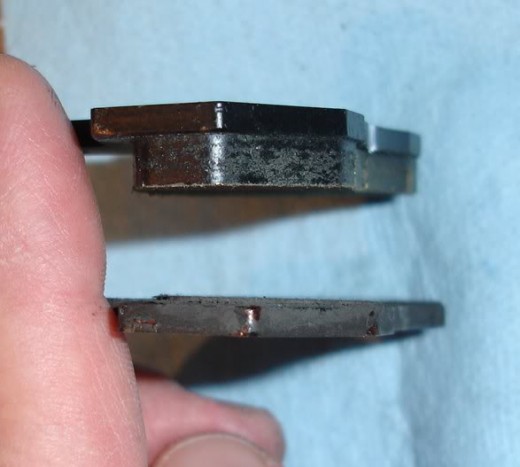The top pad is new, the bottom one is completely worn out. If this happens to your brakes you have a wheel cylinder seized or other serious mechanical fault on that wheel brake. Inspect them all and have the brakes hydraulics rebuilt