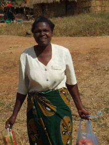 Judith Ngoma carries some of her produce to market.