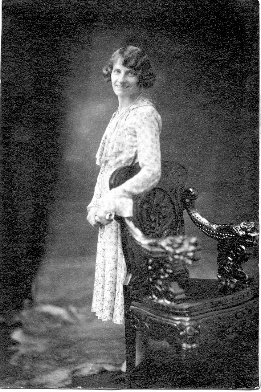 Not a classic beauty, but the hair caught my attention. The chair is beautifully carved. Chairs seem to be a popular prop.