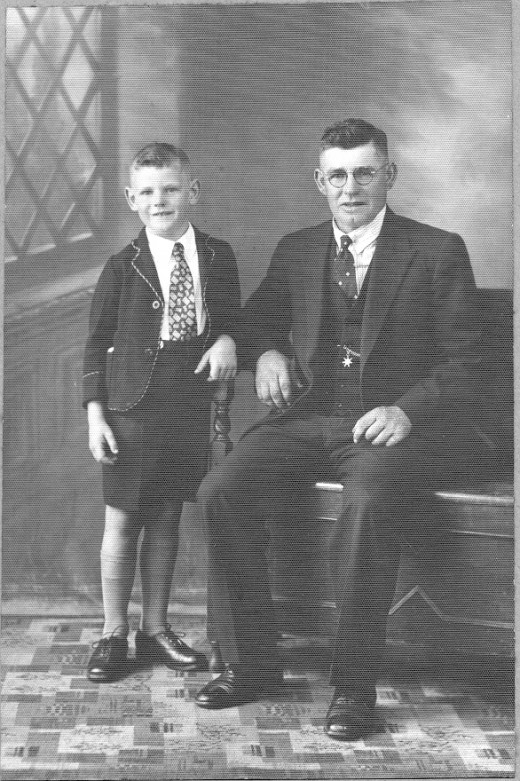 The circular spectacles, the child's school uniform, father's waistcoat and watch chain.The little boy looks so eager.