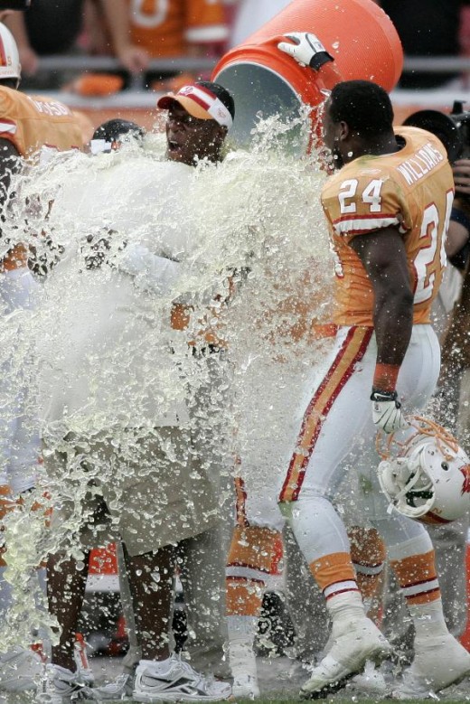 Raheem Morris is doused at the conclusion of the Buccaneers' first win of the season in an NFL football game against the Green Bay Packers, Sunday, Nov. 8, 2009, in Tampa, Fla. (AP Photo/Brian Blanco)