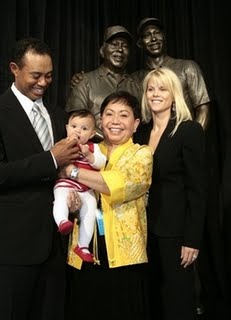 Tiger with his Mom and family at dedication of the stature of his father at the Tiger Woods Foundation