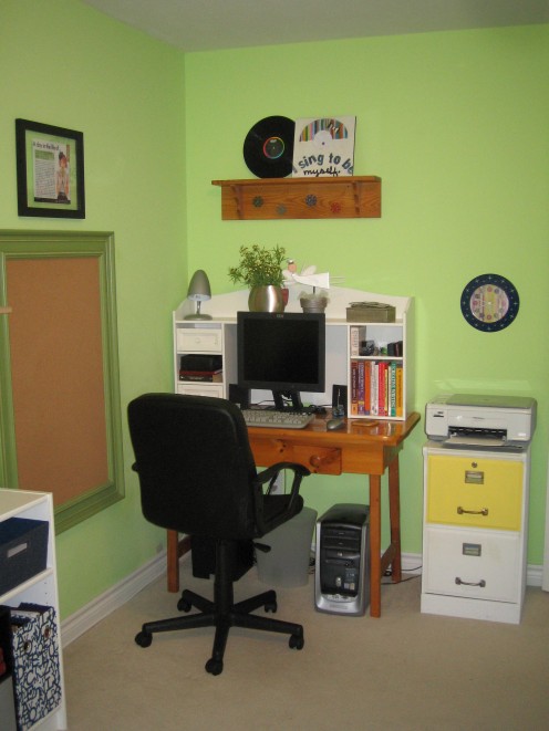 Work area with inspirational books handy and objects with inspirational messages.