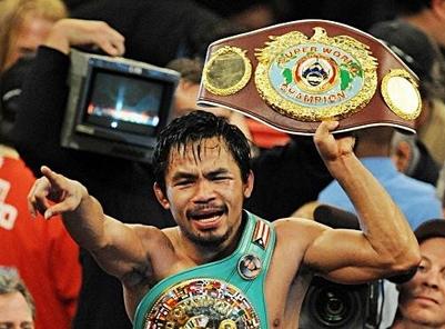 Manny Pacquiao raising the WBC welterweight championship belt he wrested from Cotto.