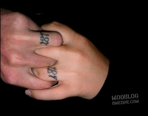 Their wedding date is tattooed in place of a ring design
