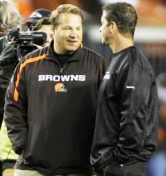Cleveland Browns coach Eric Mangini, left, talks with Baltimore Ravens coach John Harbaugh  Nov. 16, 2009, in Cleveland. (AP Photo/Mark Duncan)