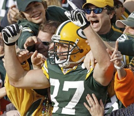 Green Bay Packers' Jordy Nelson celebrates in the crowd after catching a touchdown pass during the first half of an NFL football game against the San Francisco 49ers on Sunday, Nov. 22, 2009, in Green Bay, Wis. (AP Photo/Jim Prisching)