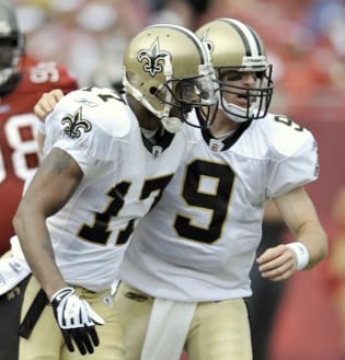 New Orleans Saints quarterback Drew Brees (9) celebrates with Robert Meachem after Meachem caught a second quarter touchdown pass from Brees during an NFL football game against the Tampa Bay Buccaneers Sunday Nov. 22, 2009 in Tampa, Fla. (AP Photo/St