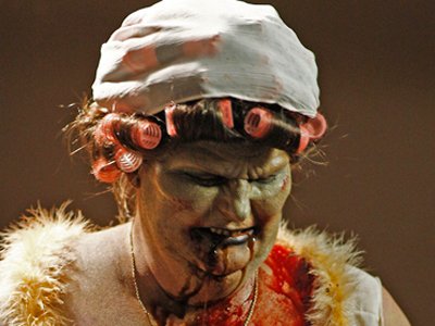 This chubby zombie woman eats finger food...ding dong!
